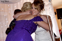 Bride hugs bridesmaid