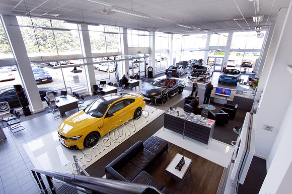 yellow M4 coupe in Marshall BMW showroom