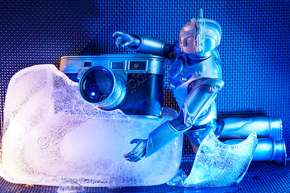 Vintage camera in ice and cyborg